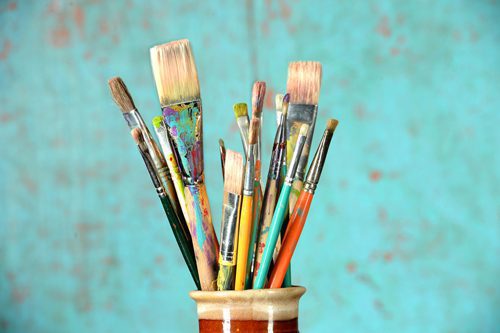 artists brushes in cup