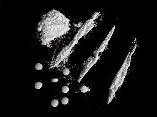 Fentanyl, Overdose of Fentanyl, white pills and lines of crushed pills - drug