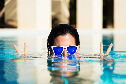 girl with sunglasses in pool