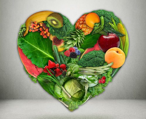 digital illustration of fruits and vegetables forming the shape of a heart - nutrition